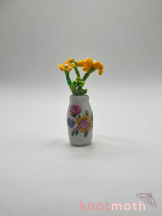 micro crochet coreopsis arrangement in ceramic vase