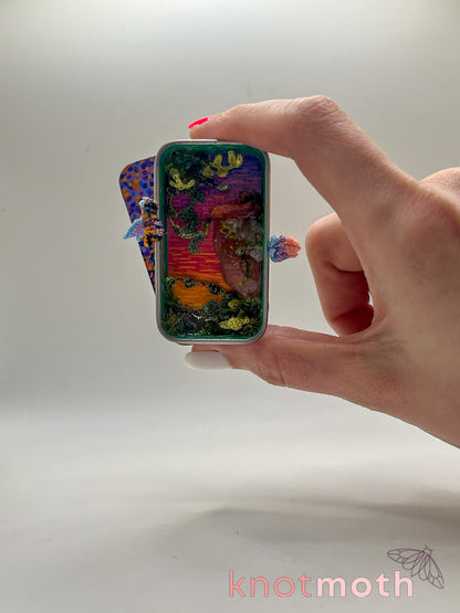 dragon & egg cliffside sunset mini tin