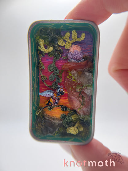 dragon & egg cliffside sunset mini tin